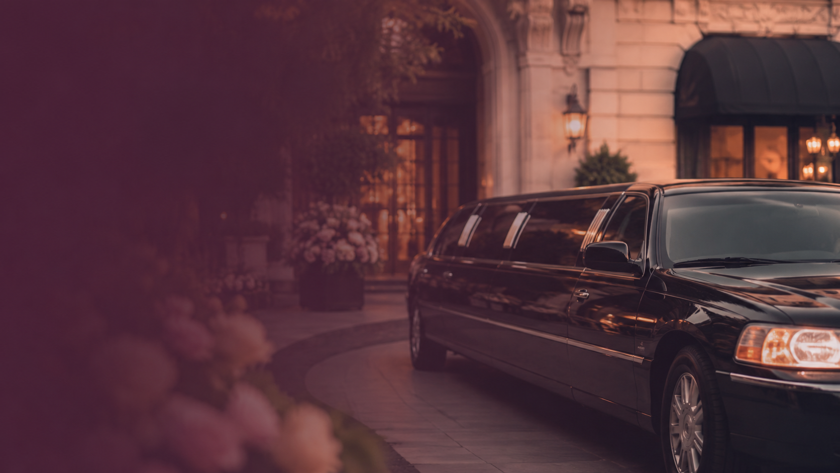 Elegant black limousine outside a wedding venue entrance